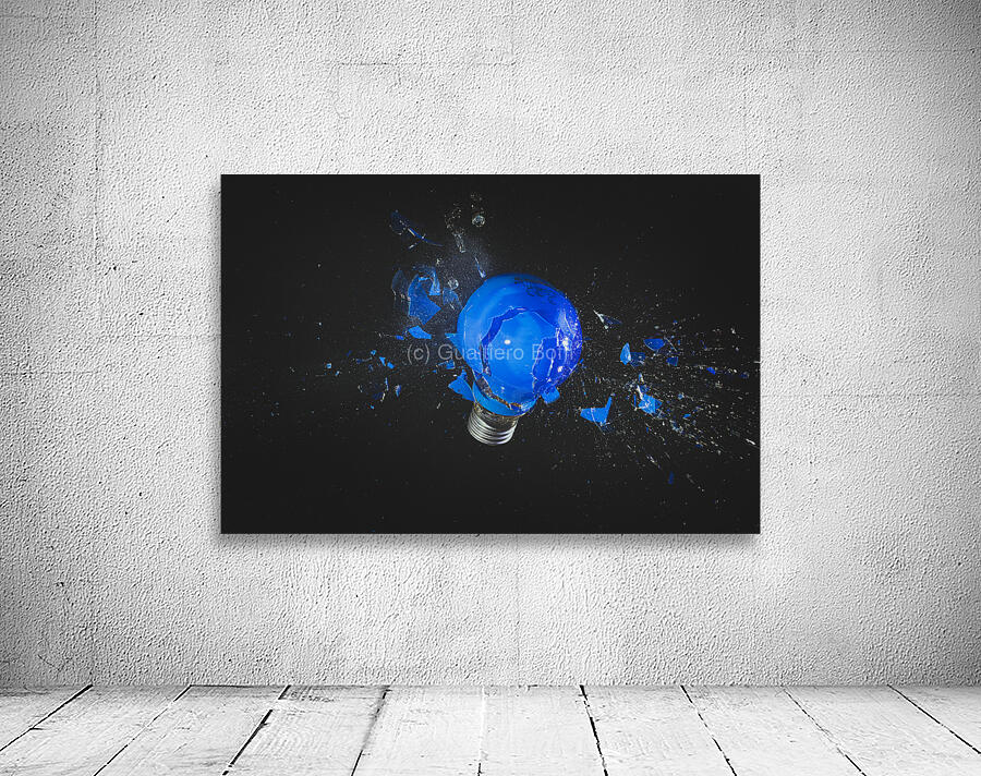 blue light bulb exploding on black.  Wall Preview