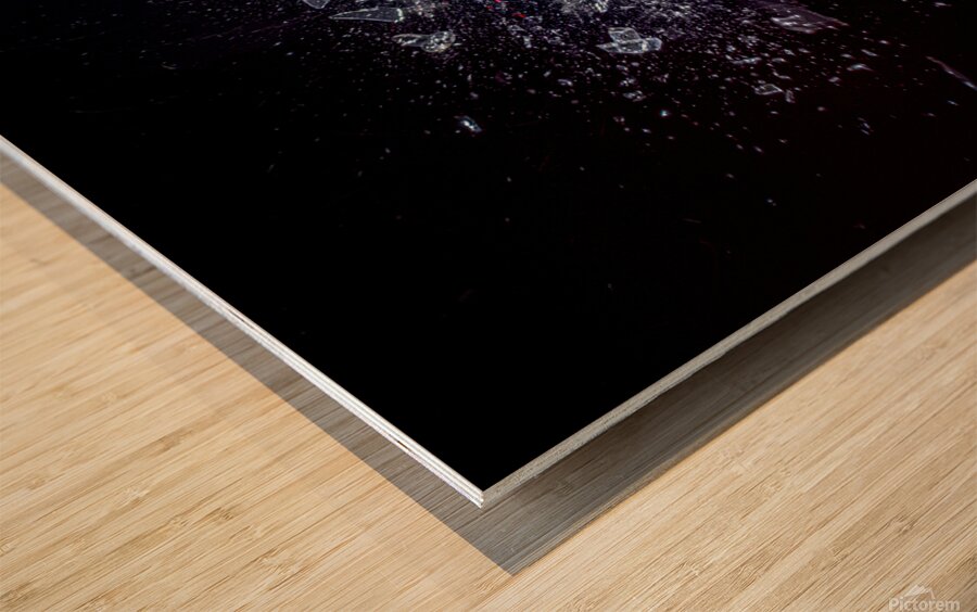 explosion of a glass ball on a black background.  Wood print