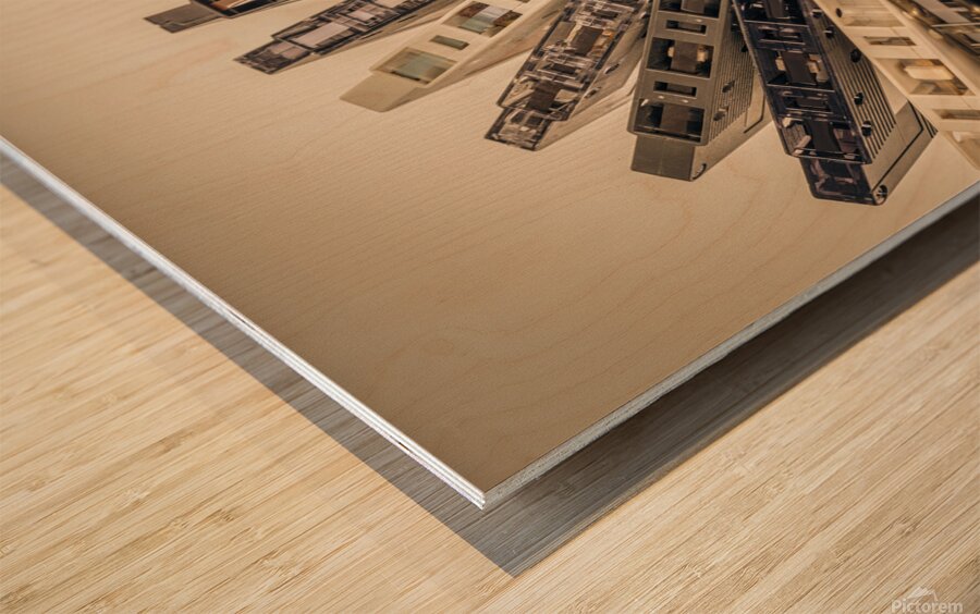 old cassettes arranged in an arc background Wood print