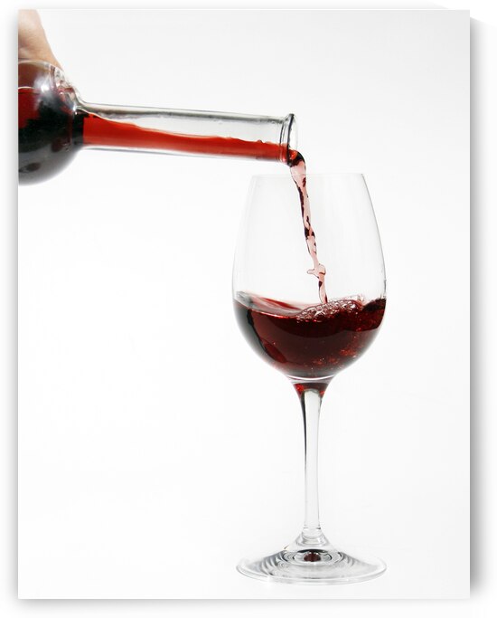 Pouring red wine into glass by Patricia Hofmeester PHotography
