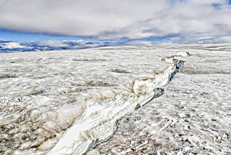 On top of a volcanic glacier with crack by Patricia Hofmeester PHotography