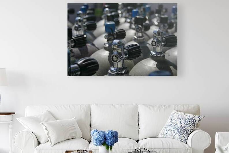Rows of scuba tanks in close up by Patricia Hofmeester PHotography