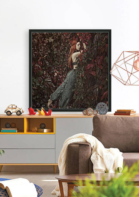 Beautiful young woman with long red hair snuggled against a huge wall of autumn leaves her feet floating in the air by Artmood Visualz