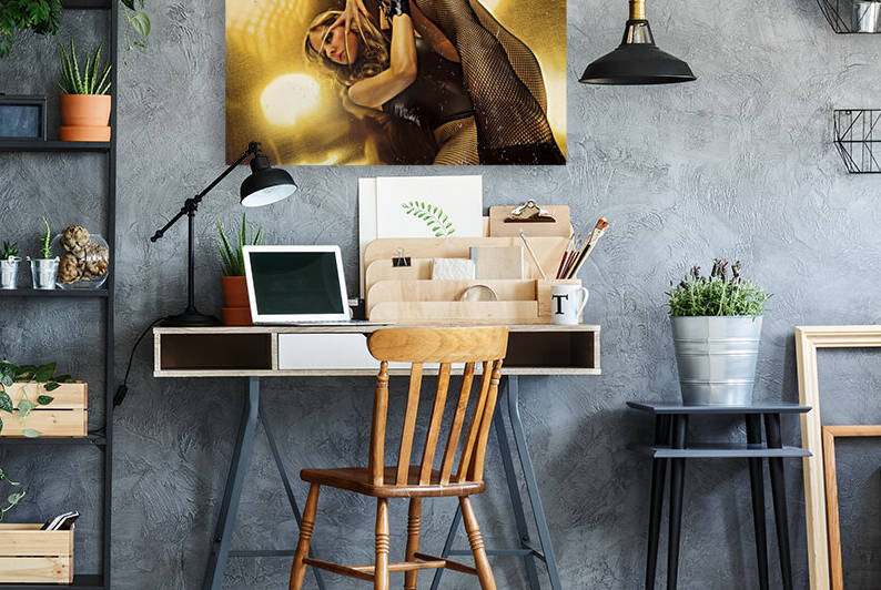 Attractive young blonde woman with long golden nails wearing fishnet stockings and handcuffs in front of a gold galvanized steel by Artmood Visualz