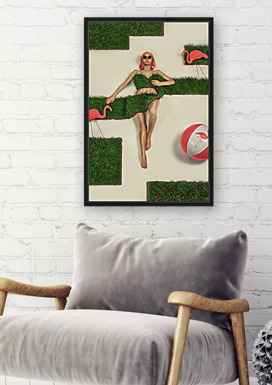 Beautiful and young pink haired woman wearing sunglasses lying down in her peat grass bikini surrounded by pink flamingos and a beach ball by Artmood Visualz