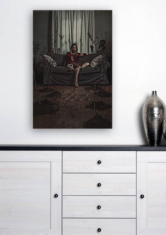 Bored blonde woman in quarantine sitting on a couch drinking red wine and throwing seeds at birds surrounding trees on the wooden floor of her living room by Artmood Visualz