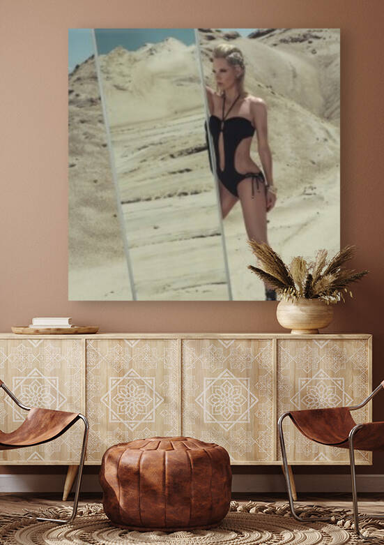 Attractive young blonde woman in a black swimsuit holding a mirror in the desert on a sunny day by Artmood Visualz