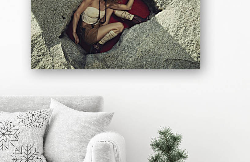 Beautiful curly blonde woman wearing an oktoberfest style outfit posing in a rock hole with a red background by Artmood Visualz