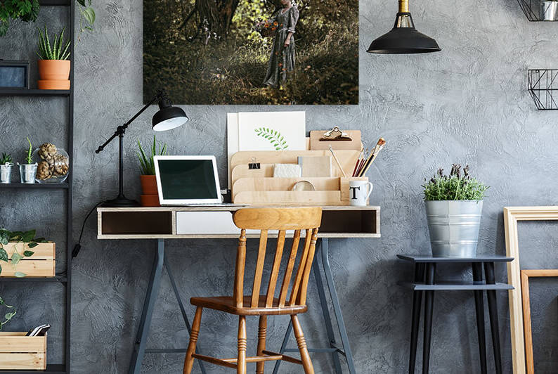 Young woman dressed as a maid from another era holding a basket full of flowers in a rural landscape by Artmood Visualz