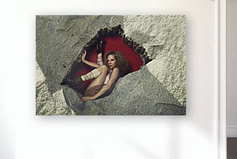 Beautiful curly blonde woman wearing an oktoberfest style outfit posing in a rock hole with a red background	 by Artmood Visualz