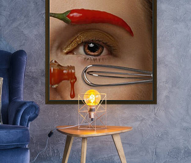 Close-up of a womans brown eye with a hot sauce bottle and a whisk as a mascara tube and applicator her eyebrow made of a red hot pepper	 by Artmood Visualz