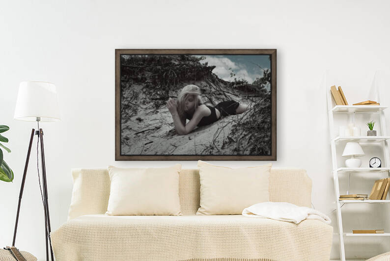Gorgeous and attractive young blonde woman wearing a long black summer dress posing sensually in sandy dunes by Artmood Visualz
