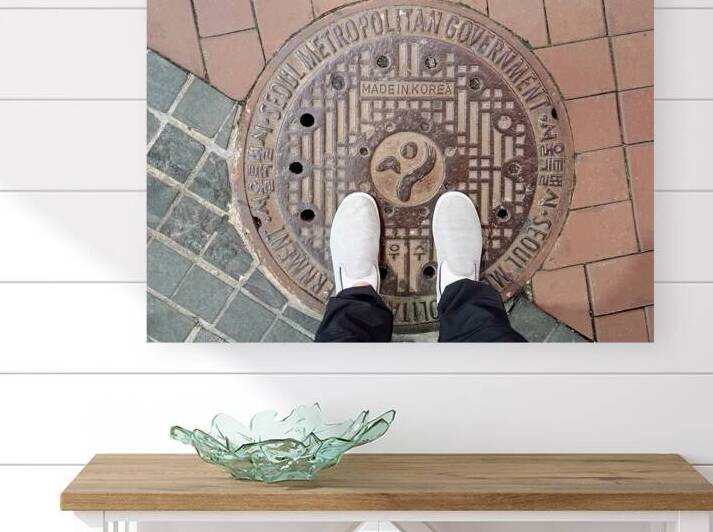 Manhole cover on sidewalk street in Seoul South Korea by Kevin Miller Photography