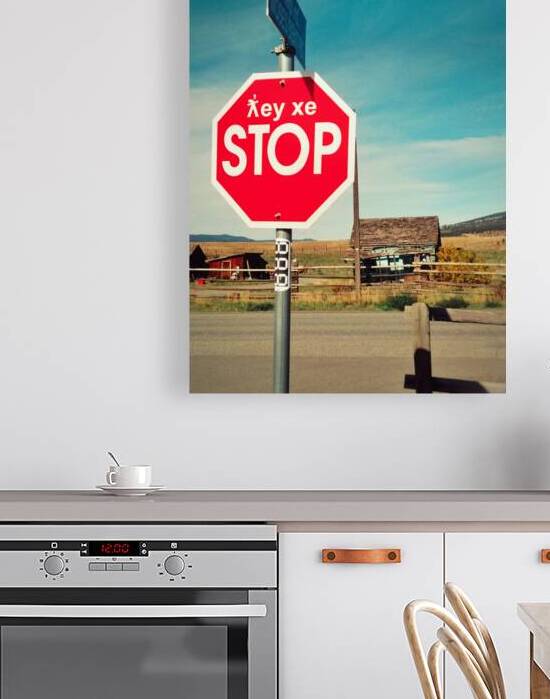 Bilingual stop sign in English and First Nations language. by Kevin Miller Photography