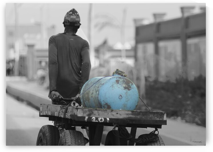 Sun-soaked Grit: Capturing the Determination of a Street Worker by Ganyobiphotos