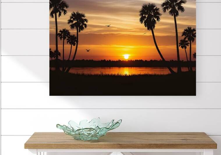 Silhouette of Paradise Palm Trees Against a Fiery by JoArt