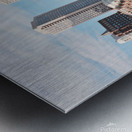 Sailboat floating by harbour with city skyline Metal print