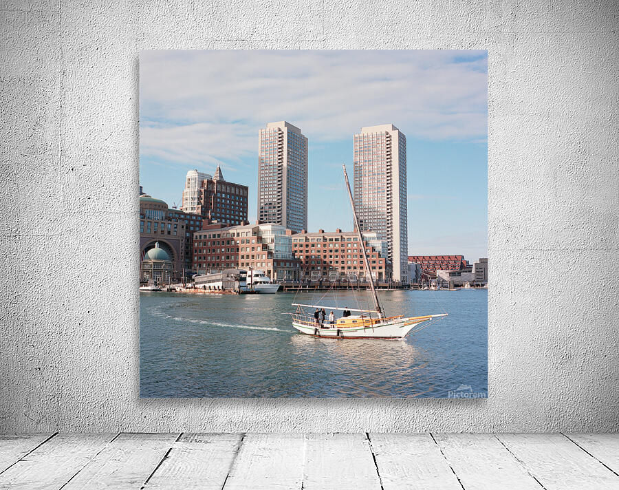 Sailboat floating by harbour with city skyline Wall Preview