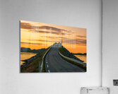 A car on the Fredvang bridges in Lofoten Norway with a beautiful sunset over the sea.  Acrylic Print