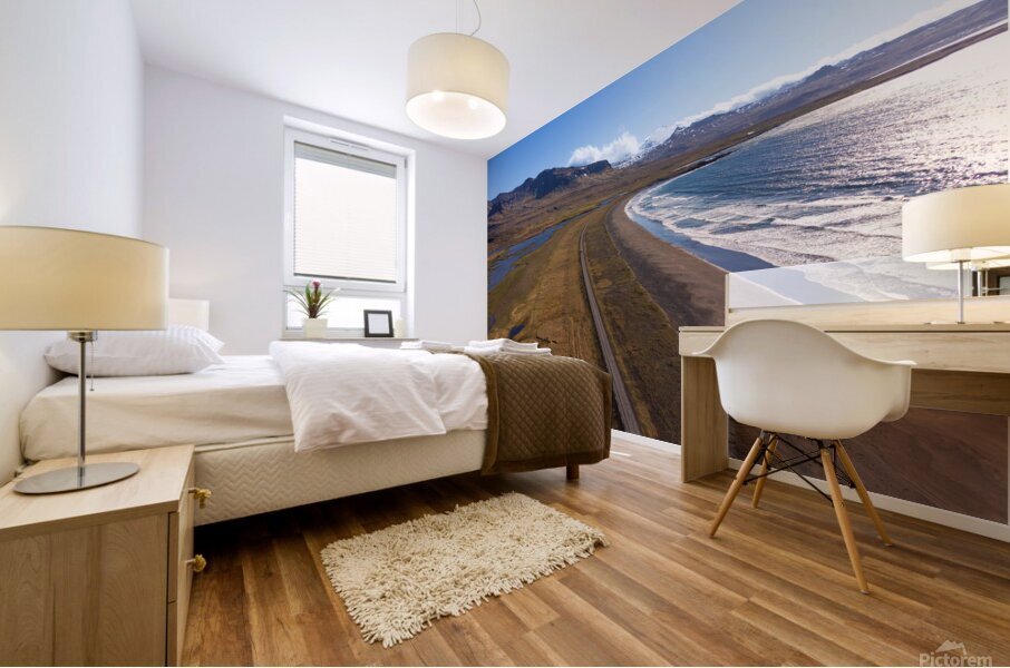 Iceland scenic route Snaefellsnes pensinsula volcano in the background covered in snow empty road with the ocean and waves. Mural print