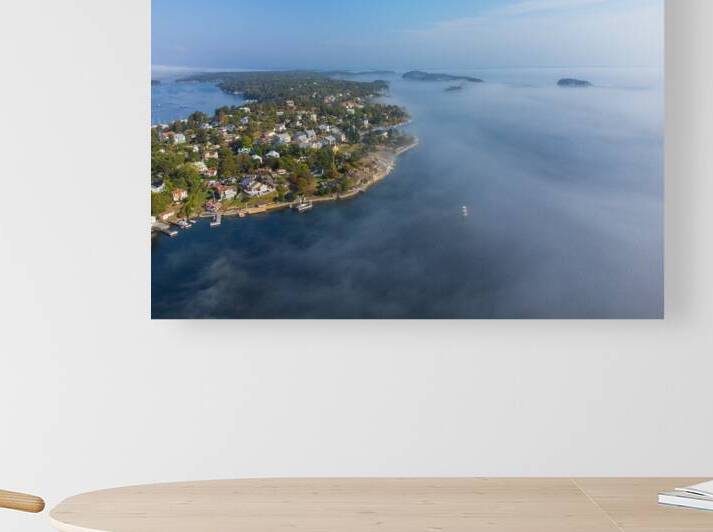Morning fog rolling over the swedish archipelago by John Nilsson