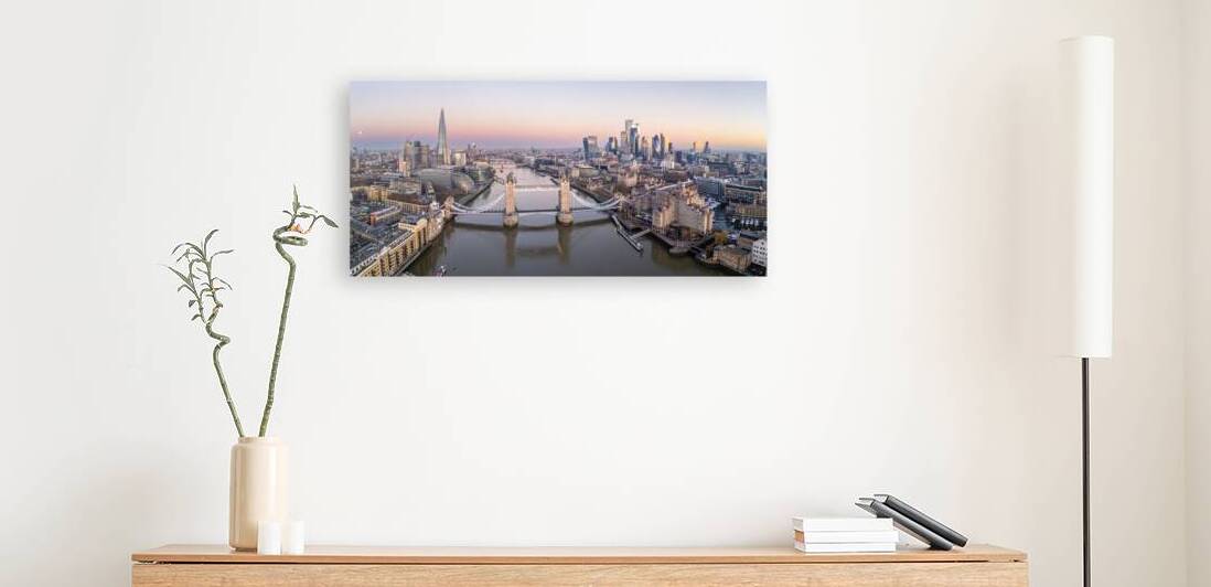 London Tower bridge with surrounding skyscrapers of the downtown at dawn by John Nilsson