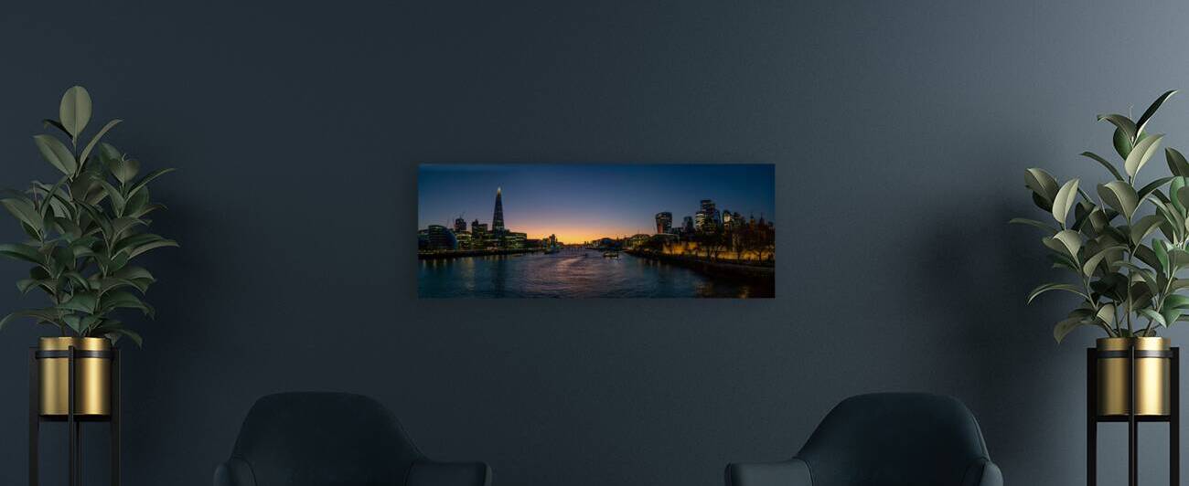 London Tower bridge with surrounding skyscrapers of the downtown at dusk by John Nilsson