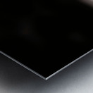 Defiant Bloom – Yellow Flower on Fence Print Metal print