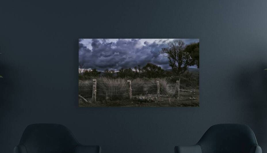 Twilight Storm Gathering Above the Rustic Fence by Murat Kucukkarakasli