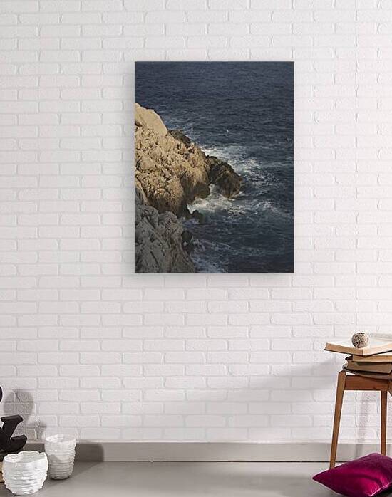 Evening Light on Rocky Coastline and Deep Blue Sea by Murat Kucukkarakasli