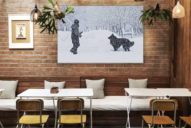 A Girl and Her Dog During a Snowstorm by Evan Petty Photography