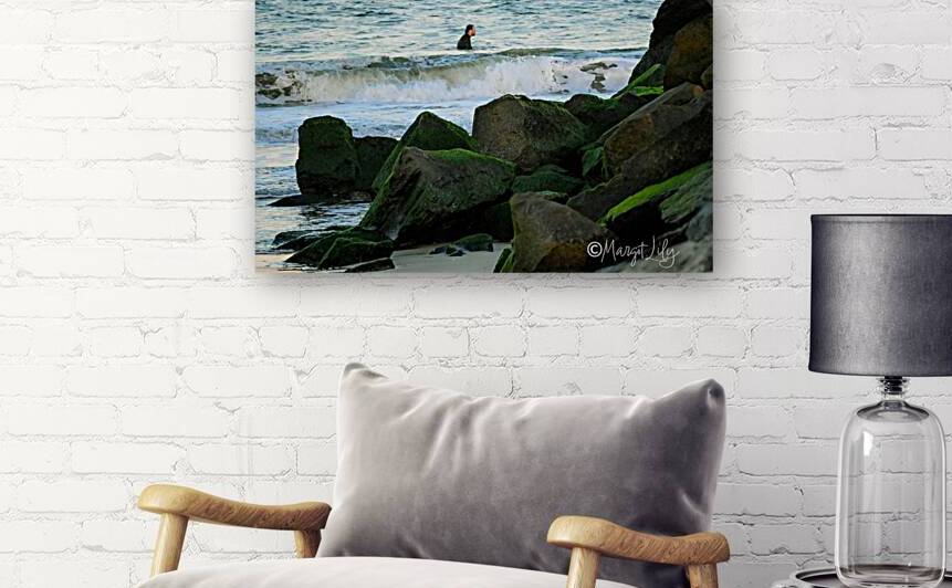 Surfer by the rocks by Margot Lily
