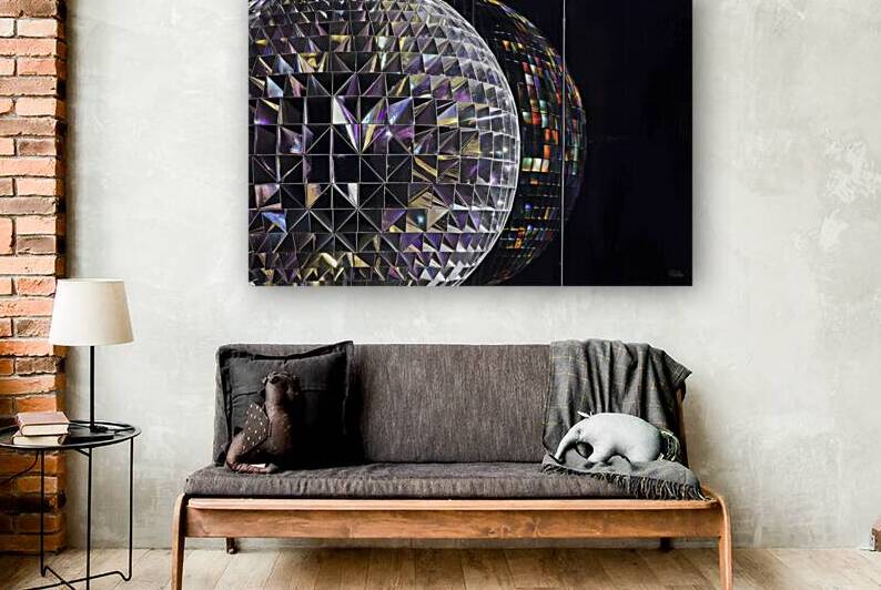 colorful disco ball on black background close up by Petre Popescu