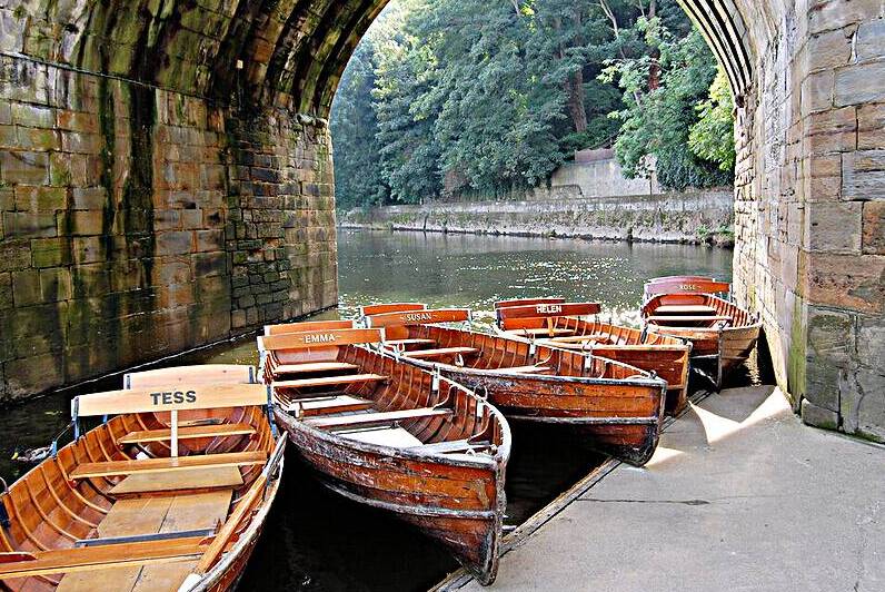 Rowing boats underneath the Mediaeval Elvet Bridge Durham England by Ross Sharp