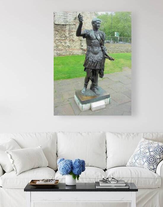 Statue of the Emperor Trajan near a section of  Roman Wall London by Ross Sharp