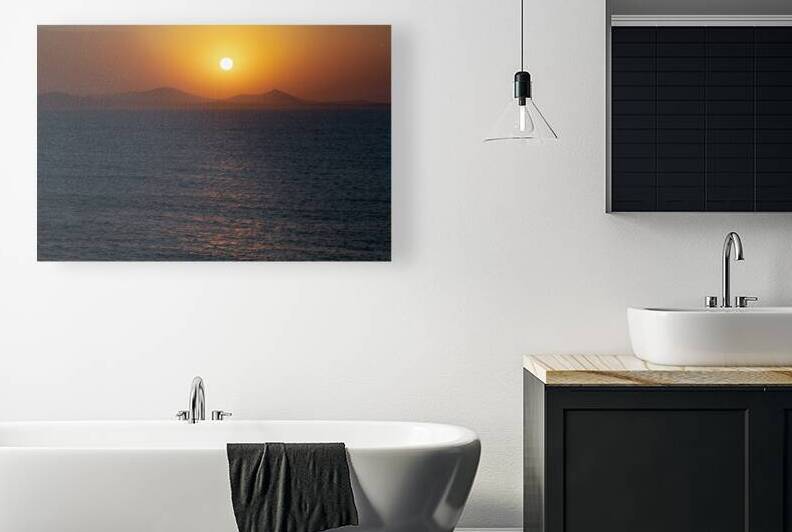 Sunset Over Calm Sea and Silhouetted Mountains by Mirko Kuzmanovic