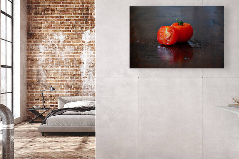 Close-up of wet ripe tomato on wooden table by Thevectoryfloor