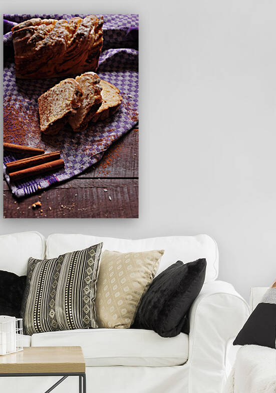 High angle view of cinnamon bread and napkin on wooden table by Thevectoryfloor