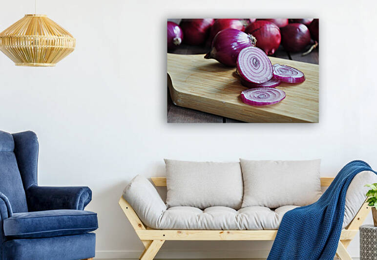 Close-up of red onion slices on wooden cutting board by Thevectoryfloor