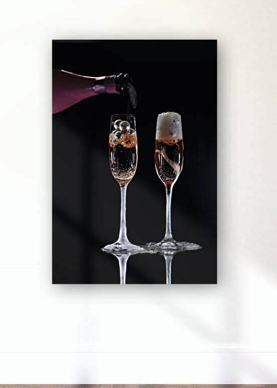 High angle view of two champagne glasses with pink champagne on black background by Thevectoryfloor
