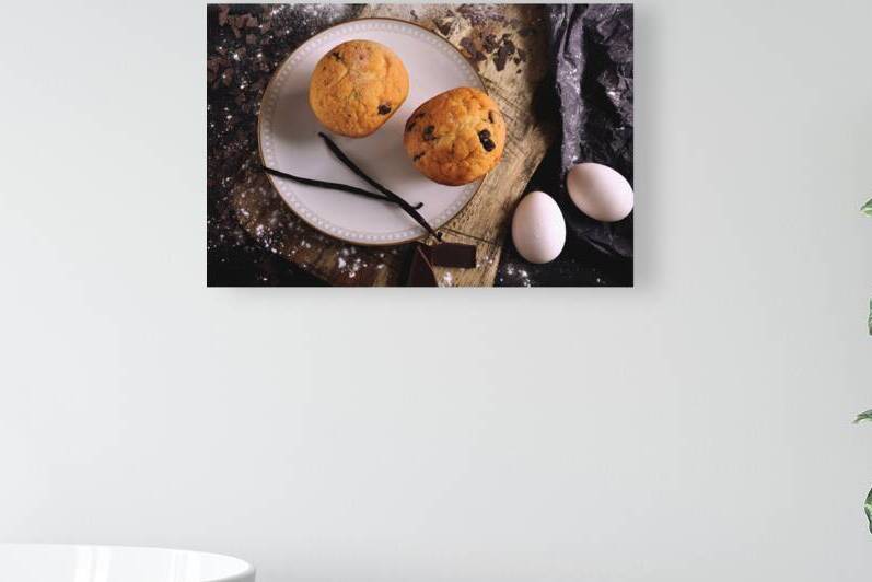 Directly above shot of chocolate chip muffins and baking ingredients on wooden table by Thevectoryfloor