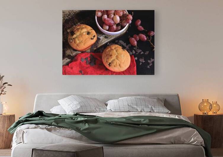 High angle view of muffins and grapes on wooden table by Thevectoryfloor