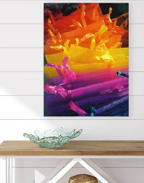 Close-up of multi colored gift bags on market by Thevectoryfloor