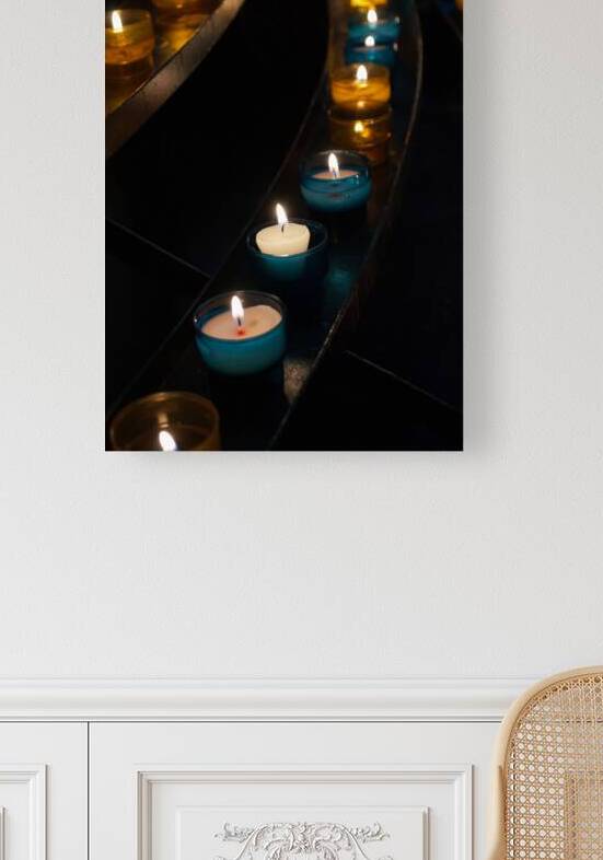 Close-up of burning candles in church on black background by Thevectoryfloor