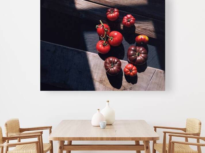 Directly above shot of variety of red tomatoes on wooden table by Thevectoryfloor