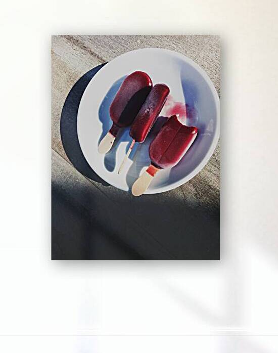 Directly above shot of ice cream popsicles on plate on wooden table by Thevectoryfloor