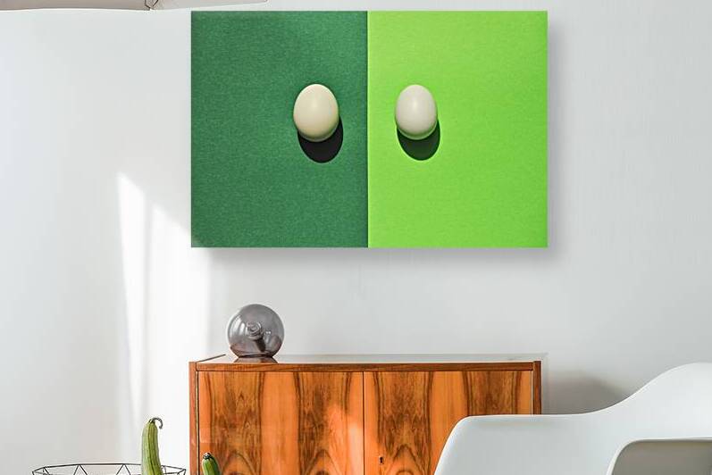 Directly above shot of two eggs on green background by Thevectoryfloor