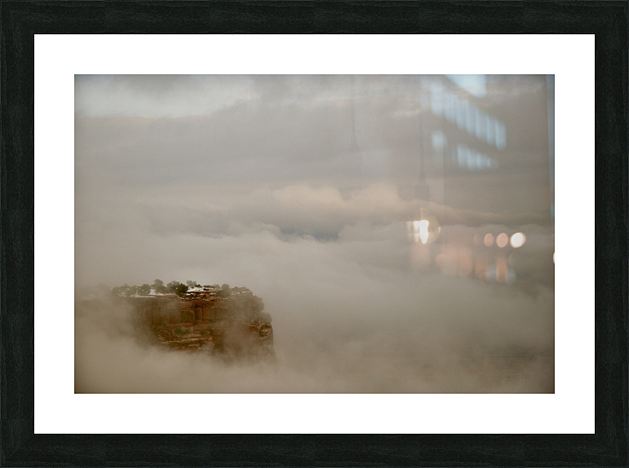 Mesa Edge Pushing Through Clouds Picture Frame print