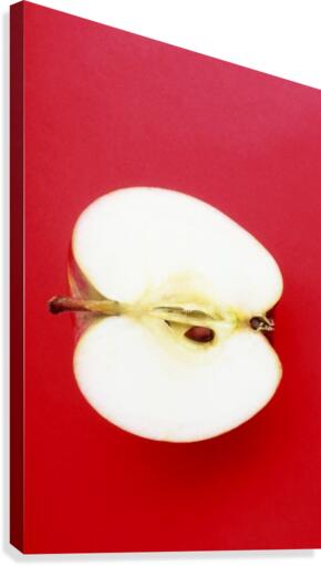 Half An Apple On Red Background Canvas Print