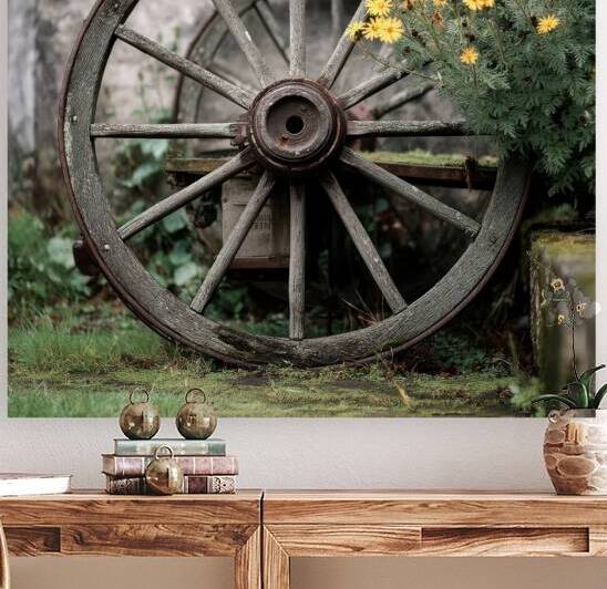 Old Wooden Wagon Wheel by Yellow Flowers by Matthias Hauser
